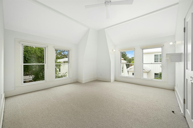 bonus room featuring ceiling fan, light colored carpet, lofted ceiling, and plenty of natural light