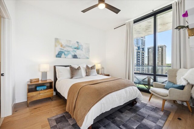 bedroom featuring ceiling fan and hardwood / wood-style flooring