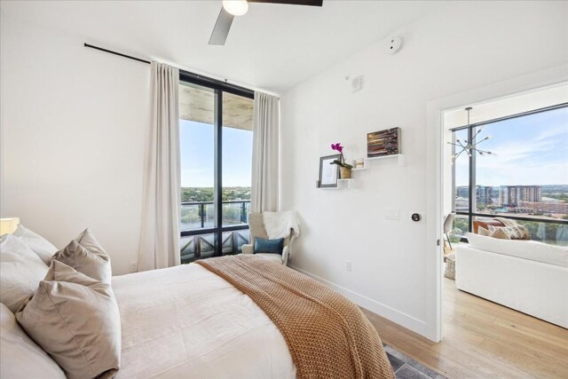 bedroom with light wood-type flooring and ceiling fan