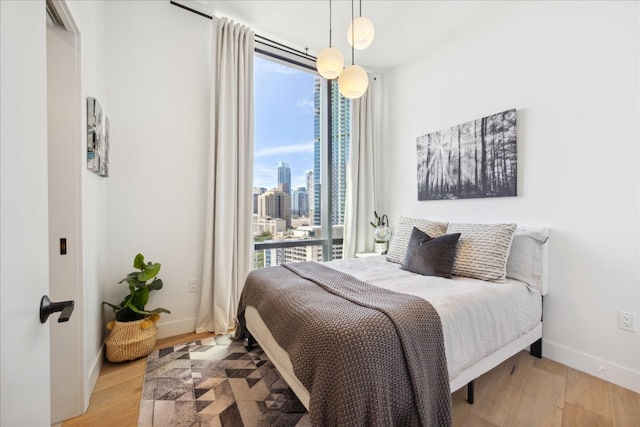 bedroom with light hardwood / wood-style floors