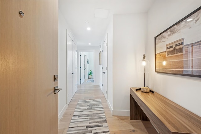 hallway with light wood-type flooring