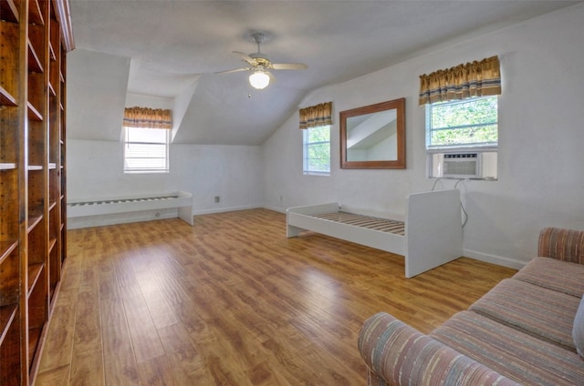 additional living space with lofted ceiling, ceiling fan, and hardwood / wood-style flooring