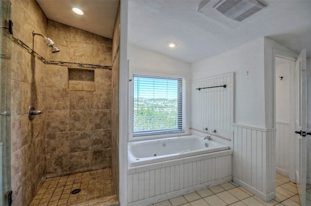 bathroom featuring vaulted ceiling, tile patterned flooring, and shower with separate bathtub