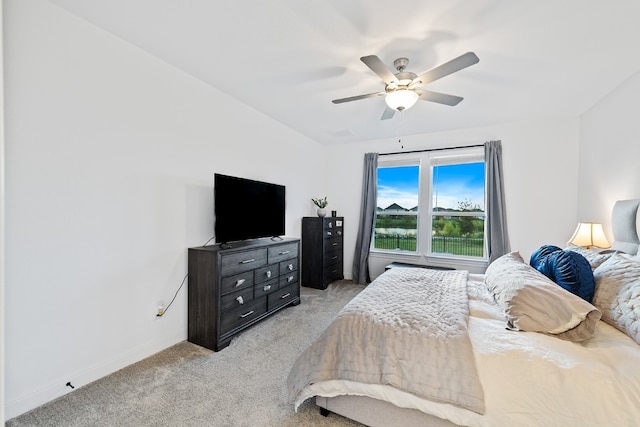 bedroom with ceiling fan and light carpet