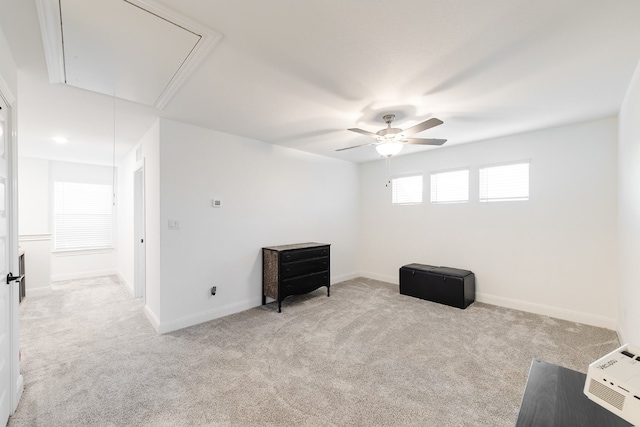 interior space featuring light carpet and ceiling fan