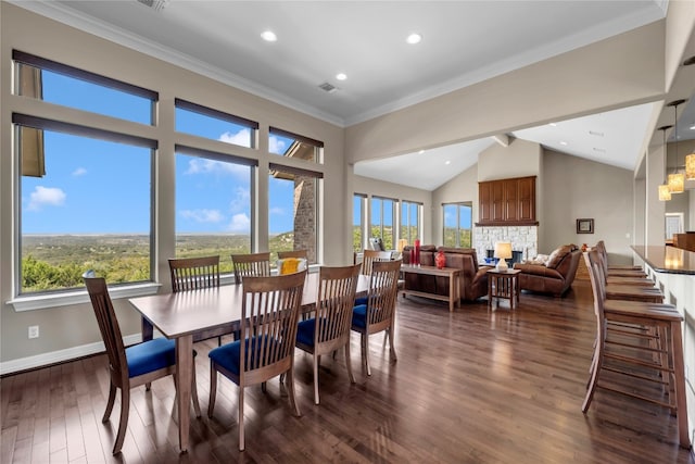 dining area featuring crown molding, a healthy amount of sunlight, and dark hardwood / wood-style flooring