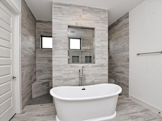 bathroom with a tub to relax in