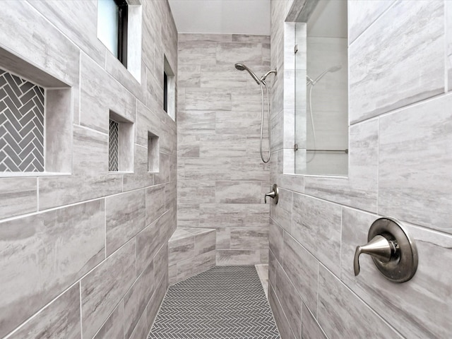 bathroom featuring tiled shower