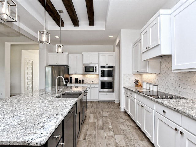 kitchen featuring white cabinets and stainless steel appliances