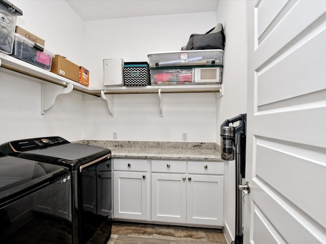 washroom featuring washing machine and clothes dryer