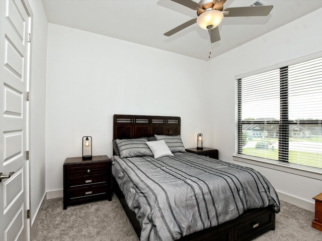 bedroom with light carpet and ceiling fan