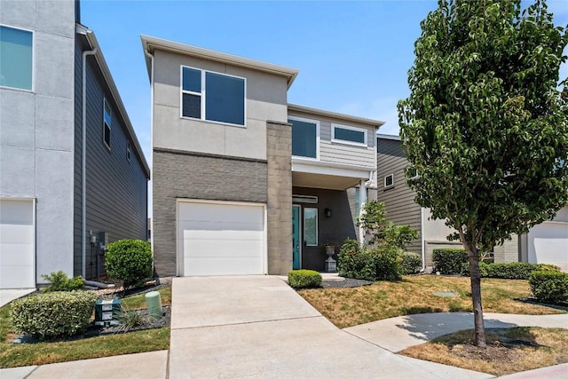 modern home with a garage, driveway, and stucco siding