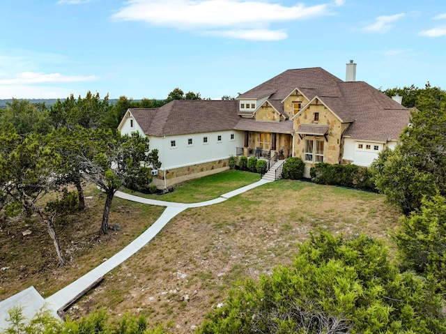 238 Landons Way, Georgetown, TX 78633 - view of front of property featuring a chimney, a front yard, stone siding, and roof with shingles