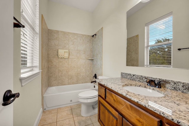 full bathroom with a wealth of natural light, tiled shower / bath, vanity, and toilet