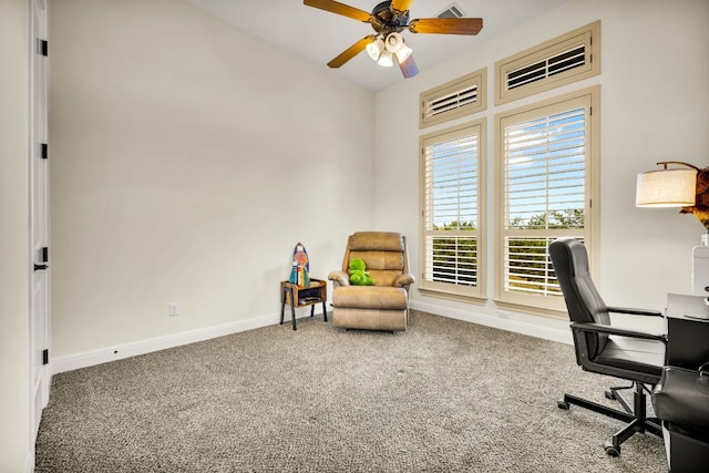 carpeted office space with ceiling fan