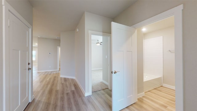 hallway with light wood-type flooring