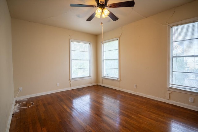 1816 Davis St, Taylor, TX 76574 - empty room with wood finished floors, plenty of natural light, and a ceiling fan