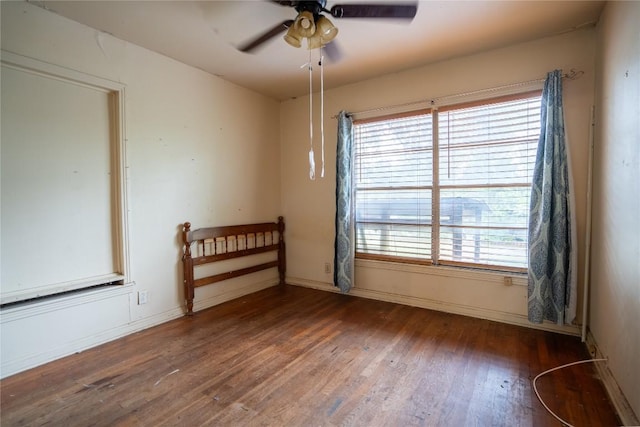 1816 Davis St, Taylor, TX 76574 - spare room with wood finished floors, a ceiling fan, and healthy amount of natural light
