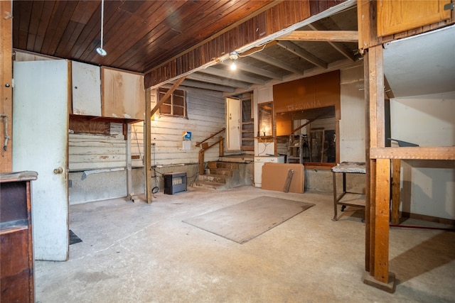 miscellaneous room featuring wooden ceiling and concrete floors