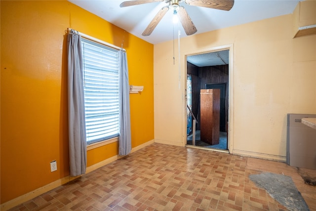 unfurnished room featuring ceiling fan