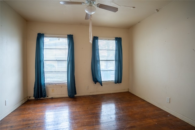 unfurnished room featuring ceiling fan and dark hardwood / wood-style floors