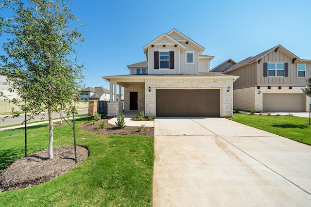 craftsman-style home with a garage and a front lawn