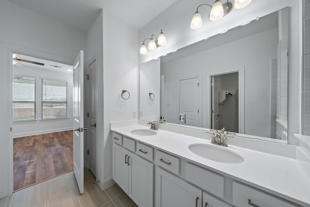 bathroom featuring vanity, tile patterned floors, and ceiling fan