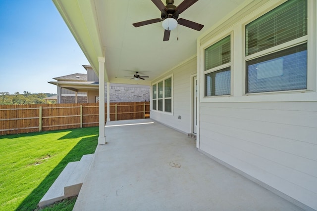 view of patio featuring ceiling fan