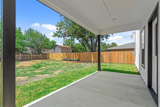 view of patio / terrace featuring a storage shed