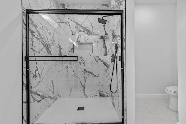 interior space featuring an enclosed shower, tile patterned flooring, and toilet