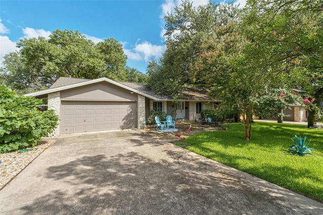 view of front of house featuring a front lawn and a garage