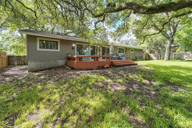 7110 Sungate Dr, Austin, TX 78731 - rear view of house with a fenced backyard, a wooden deck, and a yard