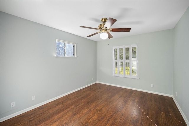 7110 Sungate Dr, Austin, TX 78731 - spare room featuring baseboards, a ceiling fan, and dark wood-style floors