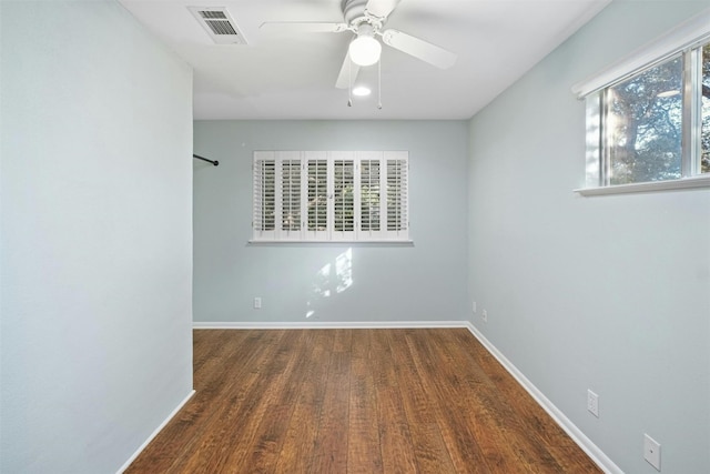7110 Sungate Dr, Austin, TX 78731 - spare room with visible vents, a ceiling fan, baseboards, and wood finished floors