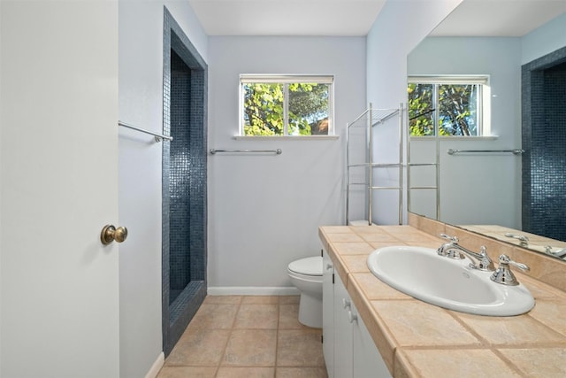7110 Sungate Dr, Austin, TX 78731 - bathroom featuring a healthy amount of sunlight, a walk in shower, vanity, and toilet