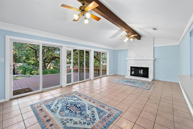 7110 Sungate Dr, Austin, TX 78731 - unfurnished living room with a ceiling fan, visible vents, tile patterned flooring, a brick fireplace, and vaulted ceiling with beams