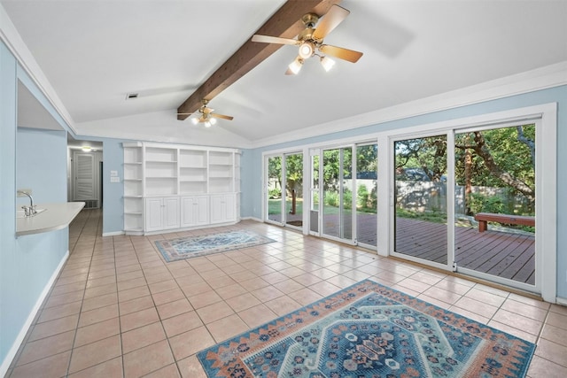 interior space featuring ceiling fan, lofted ceiling with beams, light tile patterned floors, and built in features