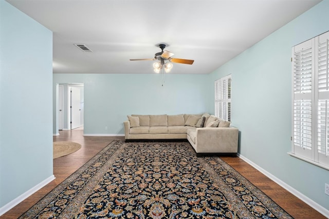 7110 Sungate Dr, Austin, TX 78731 - living room with baseboards, a ceiling fan, wood finished floors, and visible vents