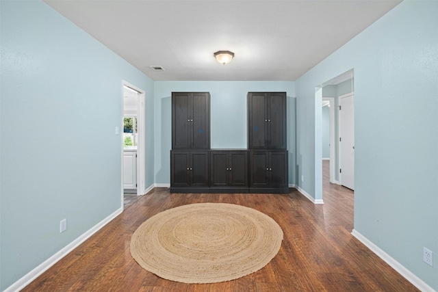 interior space with dark hardwood / wood-style flooring