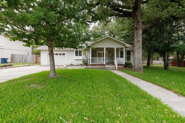 view of front of house with a porch and a front yard