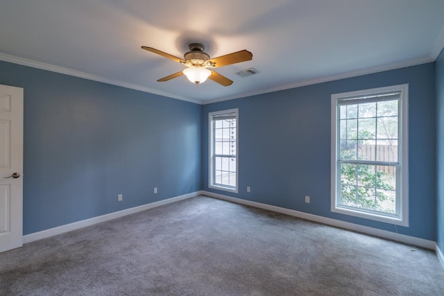 unfurnished room with ornamental molding, a wealth of natural light, and ceiling fan