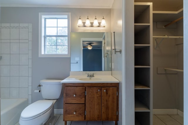 bathroom with tile patterned flooring, toilet, crown molding, and vanity