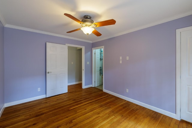 unfurnished bedroom featuring crown molding, hardwood / wood-style flooring, and ceiling fan