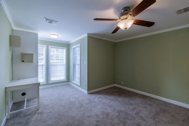 unfurnished room featuring ornamental molding, ceiling fan, and carpet flooring