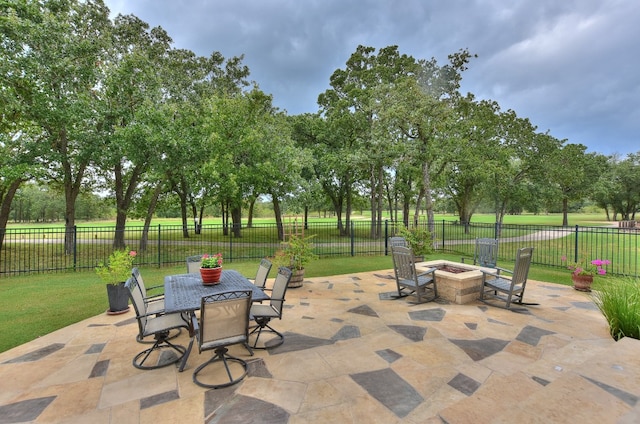 view of patio with a fire pit