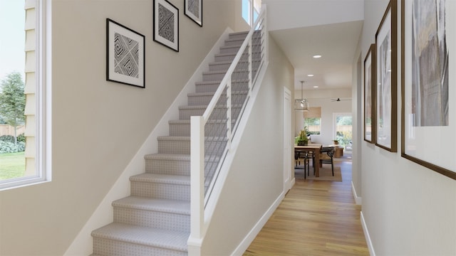 stairs with wood-type flooring