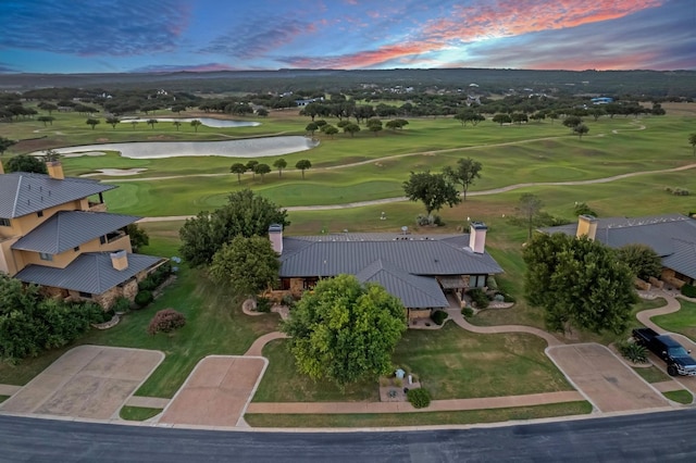 aerial view at dusk with a water view