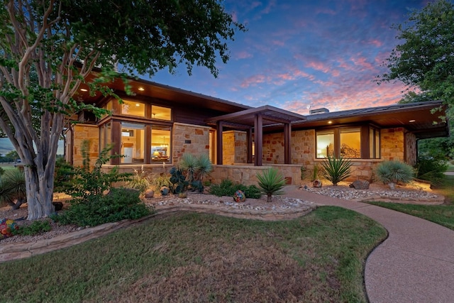 view of front of property with a lawn