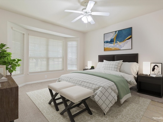 bedroom with light carpet and ceiling fan