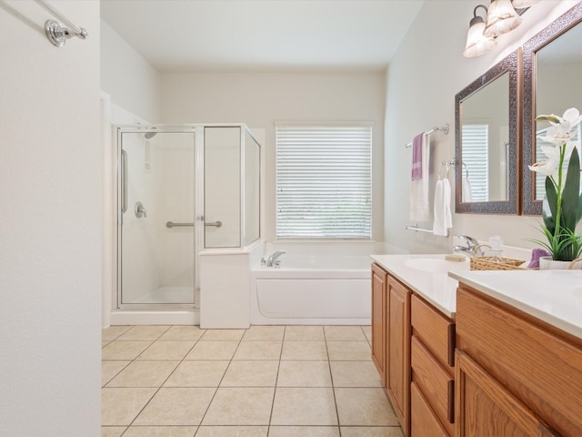 bathroom featuring vanity, independent shower and bath, and tile patterned floors